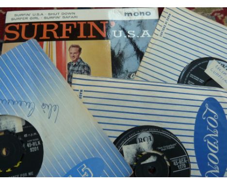 A quantity of 7" 45rpm vinyl singles such as sonny and Cher, Elvis Presley, Buddy Holly, Everly Brothers, Neil Sedaka, The Be