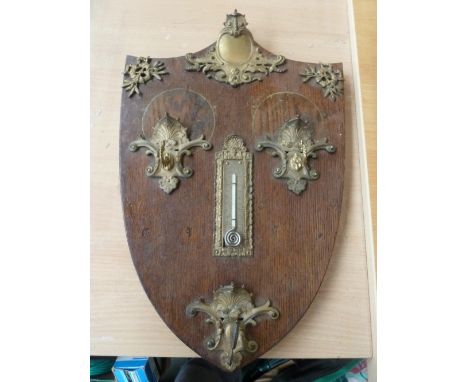 An oak and gilt metal wall hanging thermometer/key hook