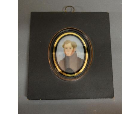 An Early 19th Century Portrait Miniature, head and shoulder portrait of a gentleman in period dress within ebonised frame, 7 