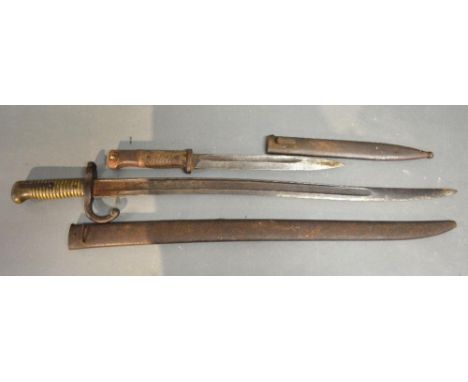 An Early German Bayonet in Metal Scabbard, together with another similar French Bayonet with Metal Scabbard 