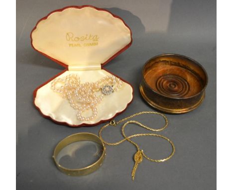 A Gold Plated Bangle together with two necklaces and a bottle coaster 