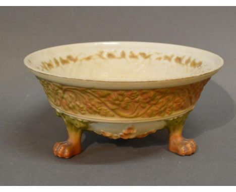A Royal Worcester Blush Ivory Bowl decorated in relief with a continuous foliate band and raised upon paw feet, 18.5 cms diam