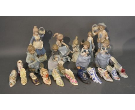 Three Lladro Porcelain Figures together with various similar figures to include Nao and a collection of model Shoes 