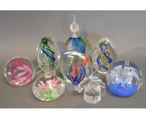 A Caithness Glass Paperweight together with seven other glass paperweights 