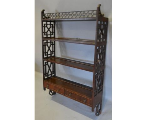 A Mahogany Chinese Chippendale Style Wall Shelf of pierced form with two drawers, 67 cms wide 