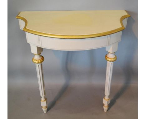 A French Cream Painted and Gilded Console Table with a Frieze Drawer, raised upon turned tapering legs, 91 cms wide 