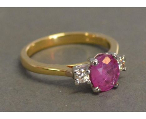 An 18ct. Yellow Gold Ruby and Diamond Ring, the ruby approximately 1.35 ct the diamond 0.15 ct 