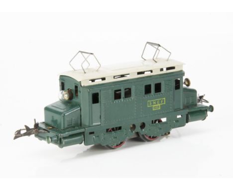 A French Hornby 0 Gauge post-war 20-volt AC electric model in SNCF green with cream roof, with rubber-stamped yellow 'SNCF 20