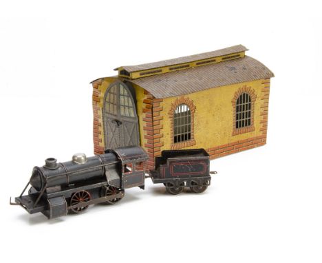 A Bub 0 Gauge clockwork German-style 0-4-0 Locomotive and Tender with Bing Engine Shed, the locomotive in lithographed red-li
