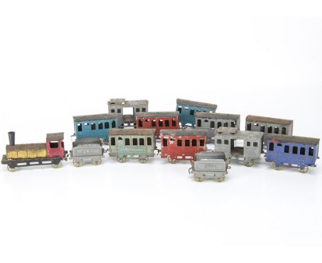 French Floor Trains by Rossignol, a 4-wheeled locomotive with gold-lacquered boiler and red cab, two tenders, both in grey wi