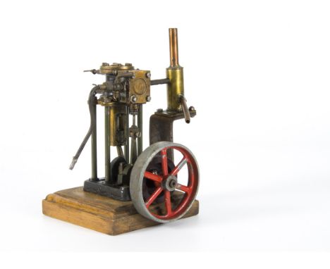 A single-cylinder vertical marine-type Steam Engine, possibly from an older Stuart Turner design, finished in green and black