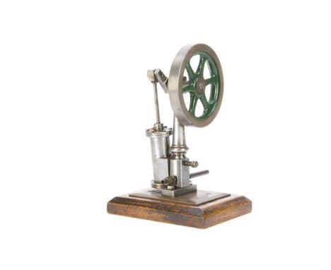 A Single-cylinder vertical oscillating Steam Engine, appears to be an older model, built around a turned steel pedestal with 