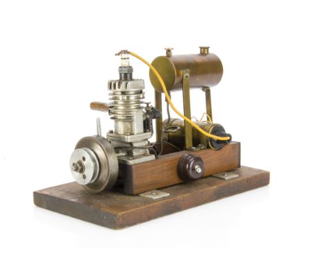 A small Single-cylinder 2-stroke Petrol Engine, of approx ¾" bore x 1½" stroke, with cast alloy cylinder, cylinder head and c