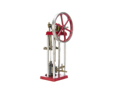 A Single-cylinder vertical Steam Engine, the frame of four turned steel pillars with 'overhead' flywheel 7" diameter and base
