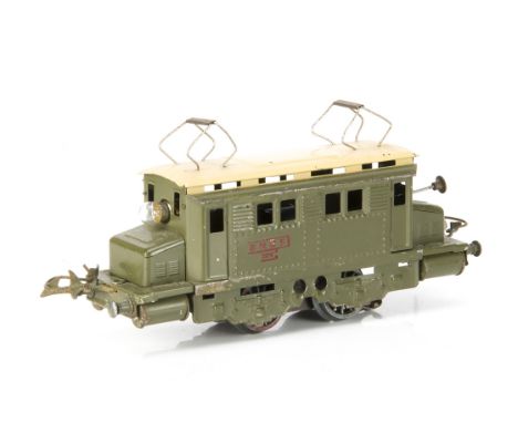 A French Hornby 0 Gauge post-war 20-volt AC electric model in SNCF khaki green with cream roof, with rubber-stamped red 'SNCF