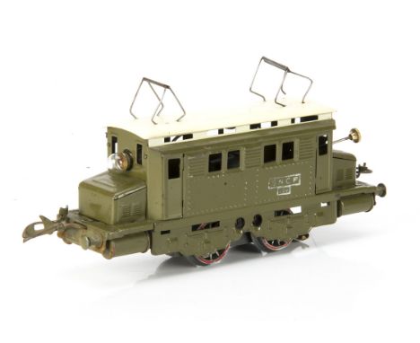 A French Hornby 0 Gauge post-war 20-volt AC electric model in SNCF khaki green with cream roof, with rubber-stamped white 'SN