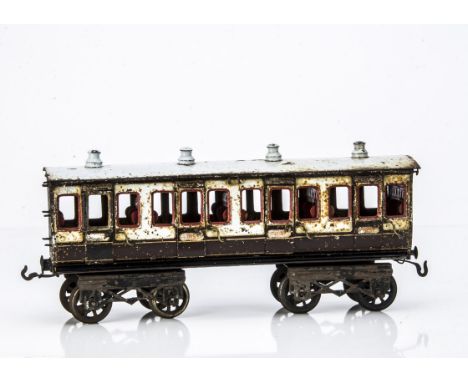 An early Bing Gauge II (2") LNWR Bogie 1st Class Coach, a possible restoration project, in LNWR brown/ivory livery, with earl