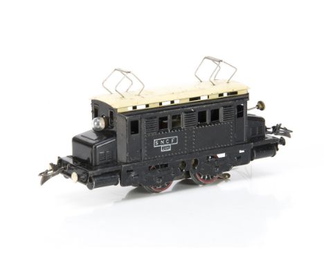 A French Hornby 0 Gauge post-war 20-volt AC electric model in SNCF gloss black with cream roof, with rubber-stamped white 'SN