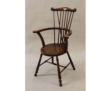 Pair of 20th Century beechwood Windsor chairs, the comb backs above circular panel seats on turned supports with stretchers 