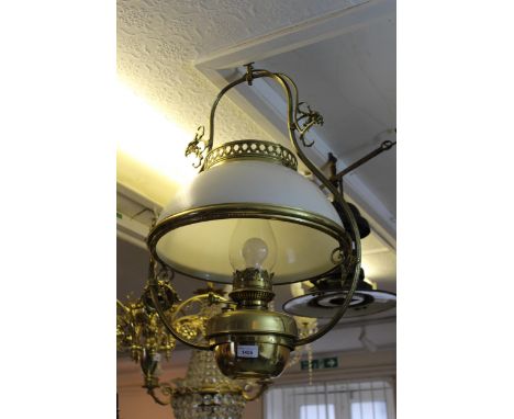 Early 20th Century brass and opaque glass hanging oil lamp, adapted for use with electricityGood condition to brass work and 