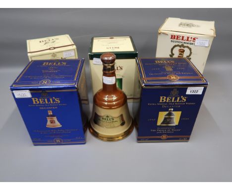 Five boxed Bell's Scotch Whisky, ceramic decanters and an unboxed Bell's ceramic decanter, all with contents 
