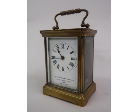 20th Century gilt brass cased carriage clock, the enamel dial with Roman numerals, with key, inscribed EXMD by Wheaton & Benn