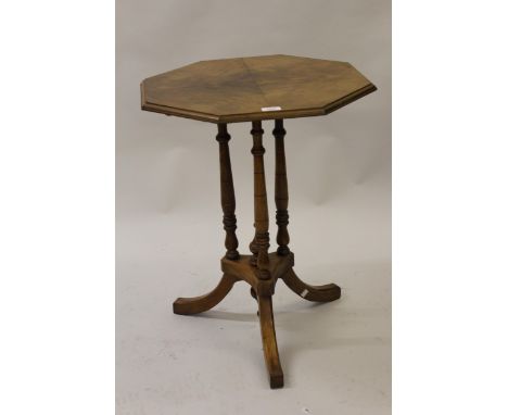 Victorian figured walnut octagonal pedestal occasional table on a tripod base, together with a pine three shelf wall bracket 