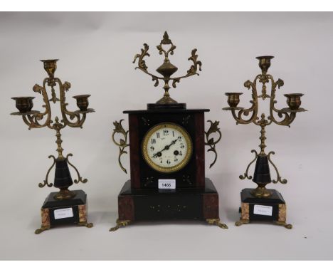 19th Century French black slate and rouge marble two train mantel clock with gilt brass mounts, together with a pair of match