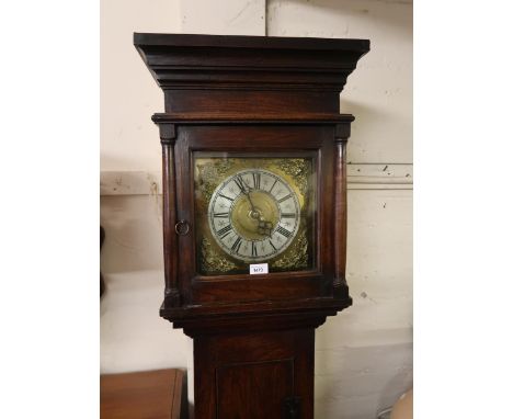 Oak longcase clock, the square hood above a rectangular door and conforming plinth base, the 10in brass dial with silvered ch