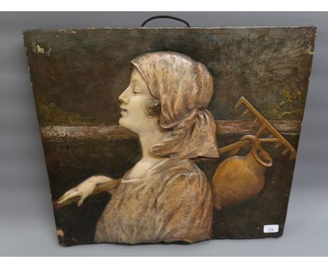 Late 19th Century Austrian painted terracotta plaque relief decorated with a portrait of a Dutch girl carrying a rake and pit
