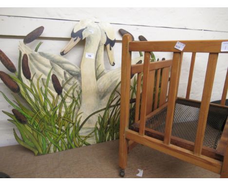 Firescreen in the form of two swans painted by Cathy Pope, together with a doll's beechwood cot 