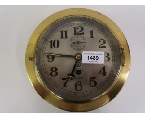 20th Century Seikosha ship's circular brass bulkhead clock, the silvered dial with Arabic numerals and subsidiary seconds, No