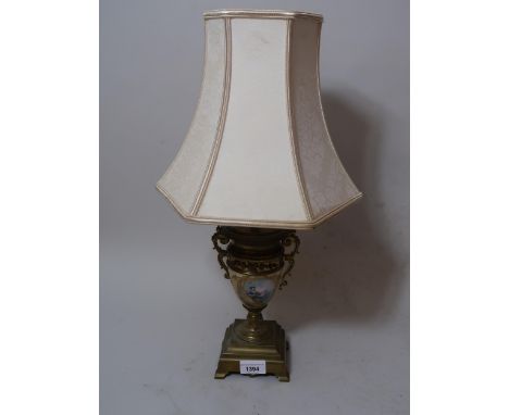 20th Century brass and porcelain table lamp painted with a musician figure 