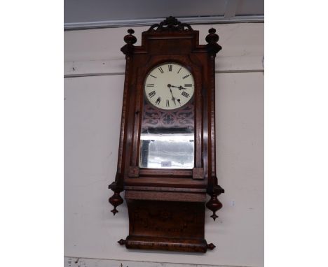 Late 19th Century figured walnut and parquetry inlaid wall clock, the pierced surmount above a glazed door and scroll shaped 