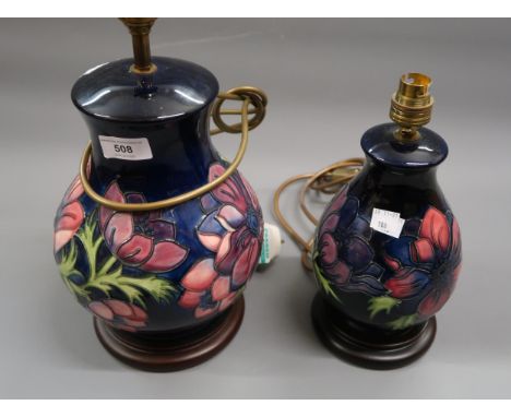 Modern Moorcroft baluster form table lamp decorated in the Peony design on a blue ground, 9.5ins high excluding the wooden ba