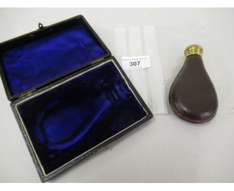 Unusual novelty perfume bottle, having gilt metal cover and leather covered body, in the form of a powder flask, in original 