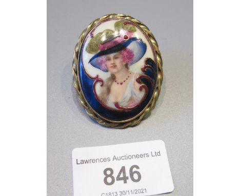 9ct yellow gold oval brooch, mounted with a porcelain plaque in Art Nouveau style with a head and shoulder portrait of a lady