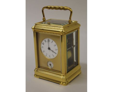 Good quality late 19th / early 20th Century French gilt brass carriage clock, the gorge case enclosing a circular enamel dial