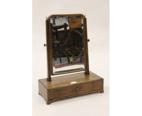 19th Century mahogany dressing table mirror, having original bevelled plate and single drawer with ogee bracket feet 