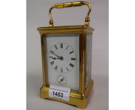 Small late 19th / early 20th Century gilt brass cased carriage clock, the enamel dial with Roman numerals and subsidiary alar