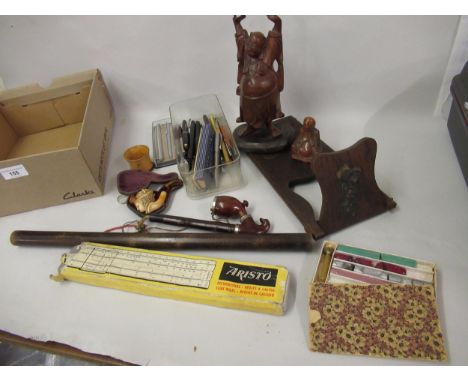 Box containing a quantity of miscellaneous items, including carved soapstone figure of a seated buddha, meerschaum pipe (at f