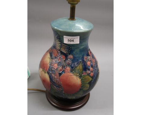 Large modern Moorcroft baluster form table lamp decorated with the Pomegranite design, 9ins tall excluding the wooden base an