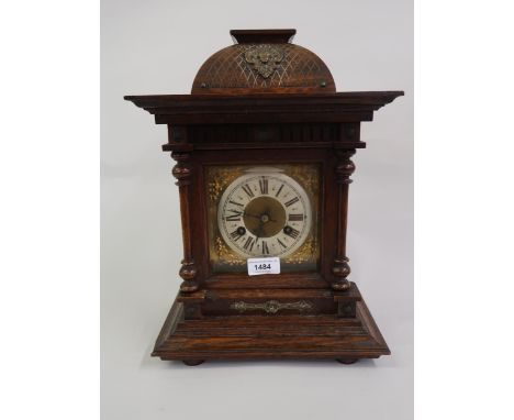 20th Century oak bracket clock, the brass dial, with silvered chapter ring, Roman numerals and two train movement, striking o