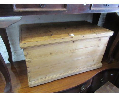 Small 19th Century stained pine trunk, with hinged cover, 31ins wide 
