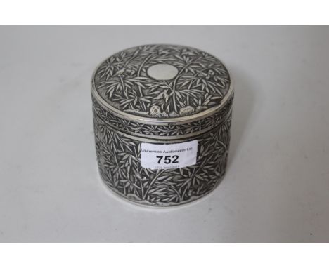 19th Century Chinese silver cylindrical box and cover, embossed with birds in bamboo, signed Luen Wo, character mark to the b