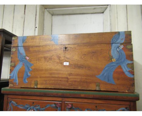 19th Century camphor wood and brass bound trunk with later painted floral and swag decoration, 37.25ins wide (at fault) 