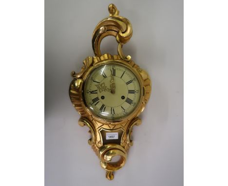 Reproduction gilt wood cartel type clock, the enamel dial with Roman and Arabic numerals, with a two train German movement st