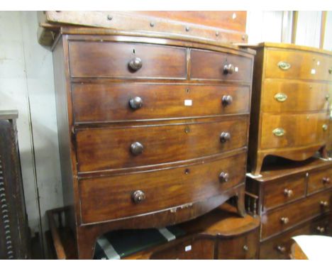 19th Century mahogany bow front chest of two short and three long drawers with knob handles and bracket feet, 41.75ins wide (