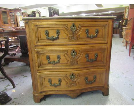 18th Century Continental fruitwood three drawer commode, the later marble top above brass handles and escutcheons on bracket 