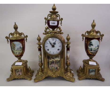 Reproduction French style gilt brass and porcelain three piece clock garniture, the enamel dial with Roman numerals and two t